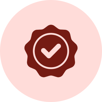 A red checkmark inside a scalloped circle on a pink background, indicating approval or certification.