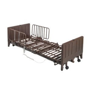 Adjustable hospital bed with wheels and side rails.
