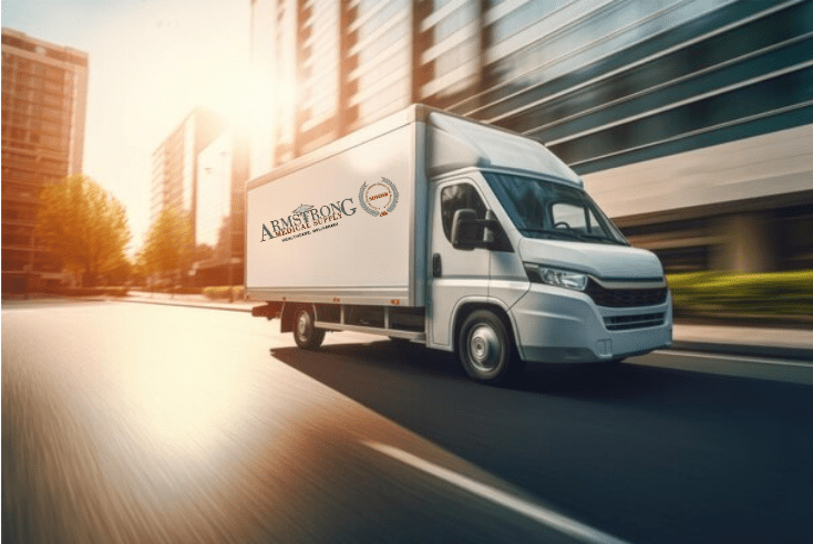 A white delivery truck driving on a city road at sunset.